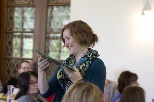 Pictured is Brooke Cox receiving an award and smiling