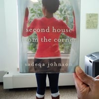 Book cover with a photograph superimposed over it to look like a woman standing in front of a window