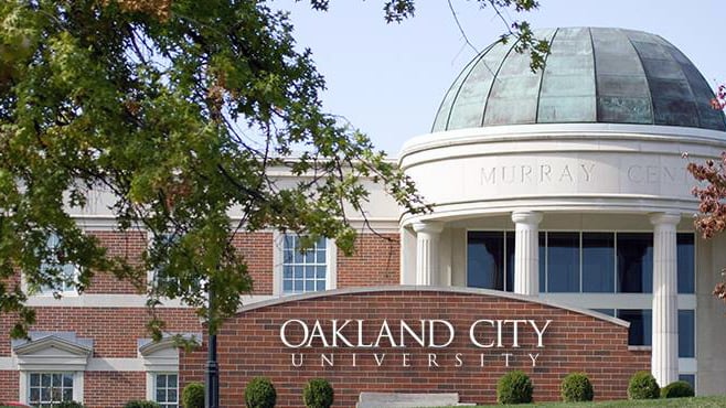 Oakland City University sign in front of domed building
