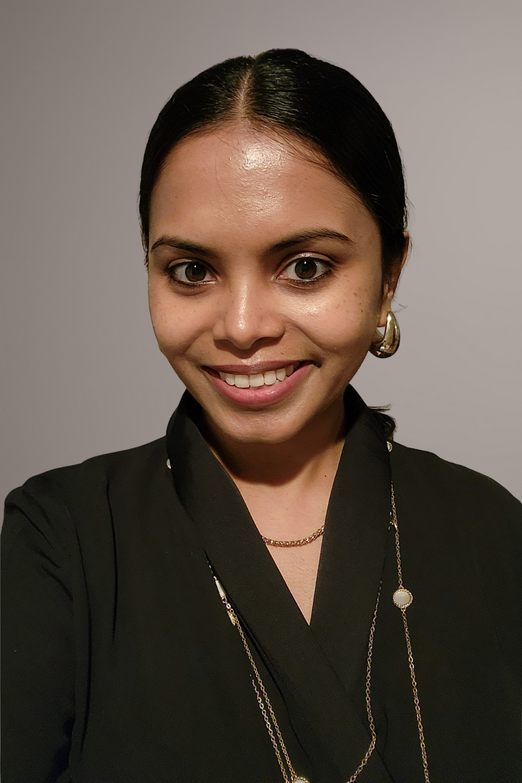 Professional headshot of Rishani De Costa